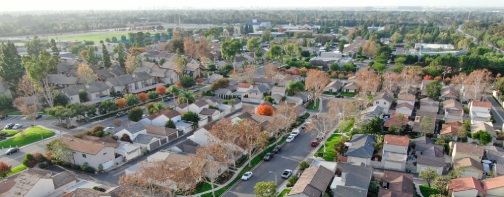 Aerial view of middle class suburban neighborhood with houses next to each other in Irvine, California, USA. Aerial view of residential area.